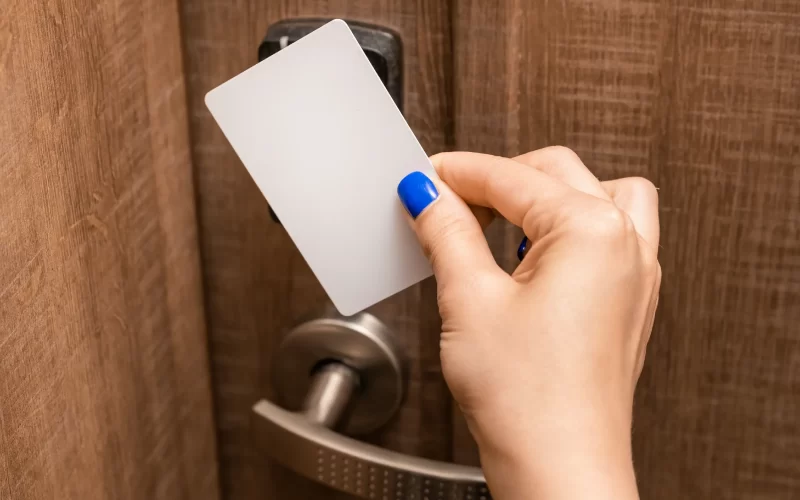 woman-hand-puts-key-card-to-panel-and-opens-door-c-2023-11-27-05-04-11-utc